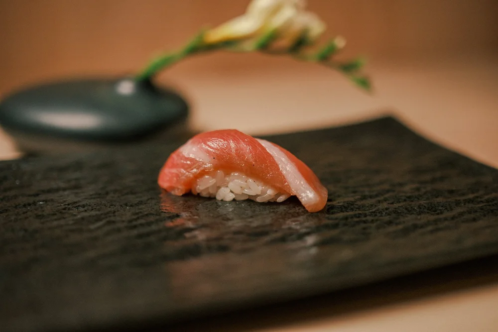 Traditional Edomae-style sushi preparation at Atto Sushi